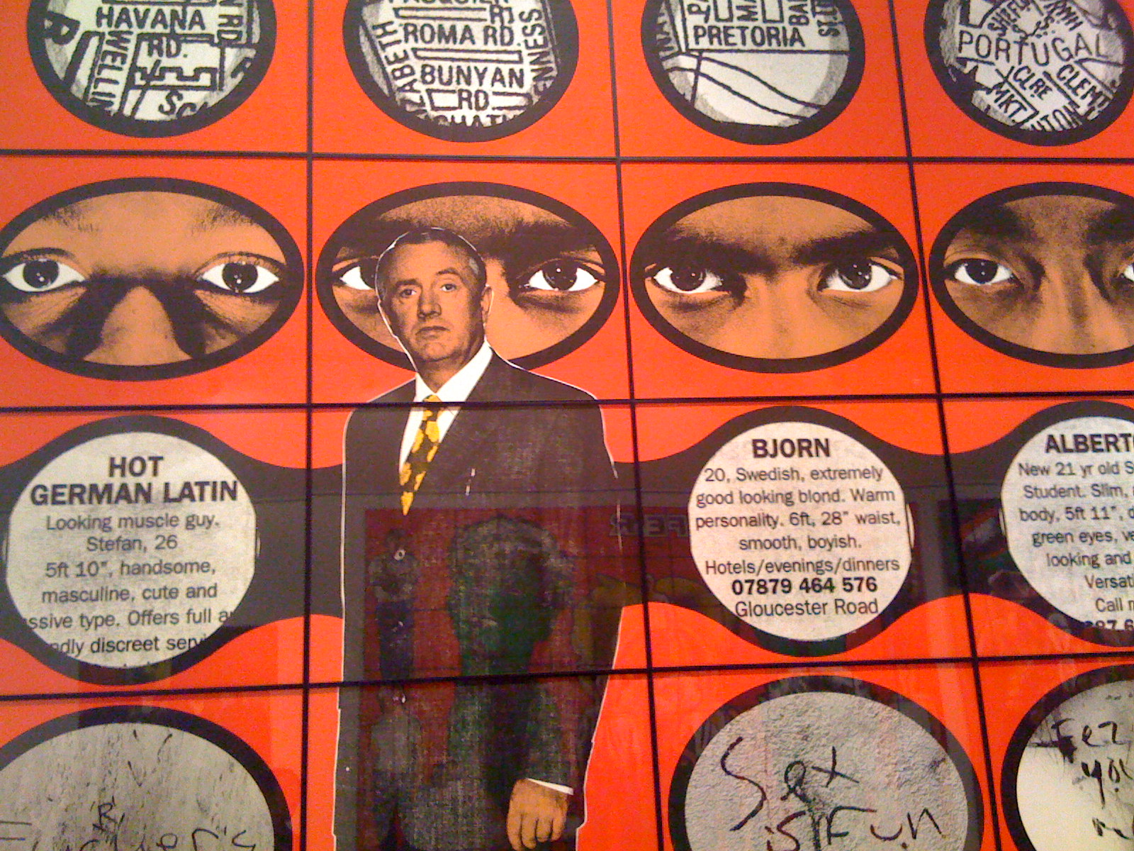 Here, Gilbert & George paste real personals into their piece, alongside crude graffiti, eerie eye-shots, and photographs of themselves. There’s Gilbert pictured in front of the personals.